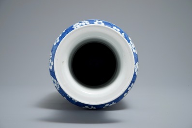 A Chinese blue and white rouleau vase with prunus on cracked ice, 19th C.