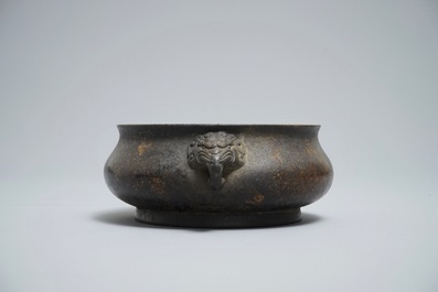 A Chinese bronze incense burner with elephant head handles, qianqing gongbao mark, Ming