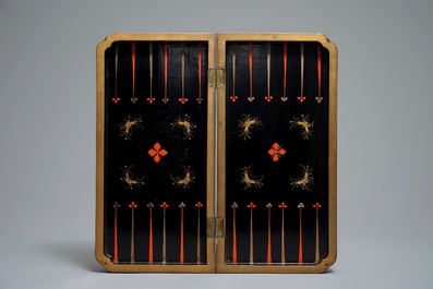 A Chinese lacquered chess and backgammon board with ivory chessmen, 19th C.