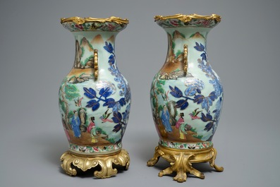 A pair of Chinese gilt-bronze mounted famille rose celadon vases, 19th C.