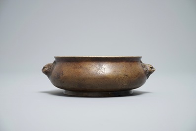 A Chinese bronze censer on wooden stand, Xuande mark, 18th C.