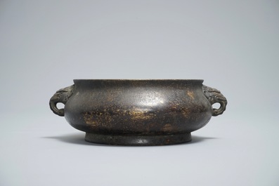 A Chinese bronze incense burner with elephant head handles, qianqing gongbao mark, Ming