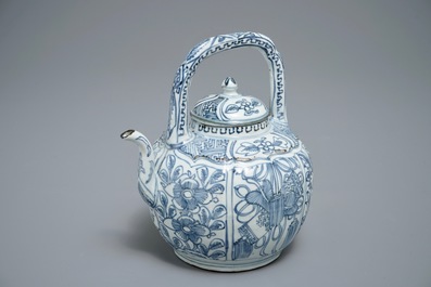 A Chinese blue and white kraak porcelain wine jug and cover with precious objects and flowers, Wanli