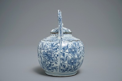 A Chinese blue and white kraak porcelain wine jug and cover with precious objects and flowers, Wanli