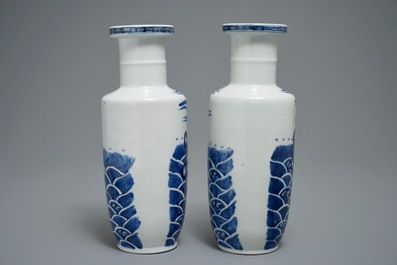 A pair of Chinese blue and white rouleau vases with carps, Kangxi mark, 19th C.