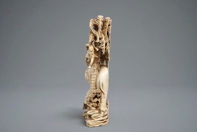 A Chinese carved ivory group of a lady with an elephant, 1st half 20th C.