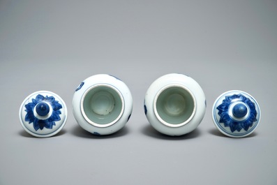 A pair of Chinese blue and white miniature vases and covers or tea caddies, Kangxi