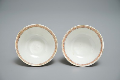 A pair of fine Chinese famille rose cups and saucers with figures in a garden, Yongzheng/Qianlong