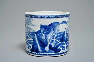A Chinese blue and white cylindrical brush pot or bitong with mythical beasts, Kangxi