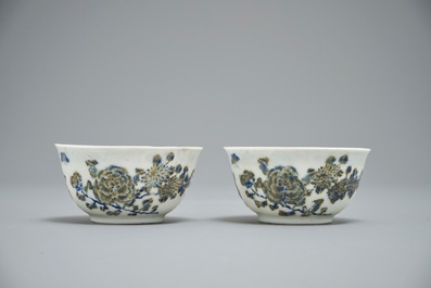 A pair of Chinese eggshell cups and saucers with overglaze blue and gilt floral design, Yongzheng