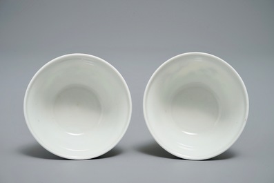 A pair of Chinese blue and white mythological cups and saucers depicting Neptune, Qianlong