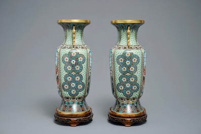 A pair of Chinese parcel-gilt cloisonn&eacute; vases on wooden stands, 1st half 20th C.