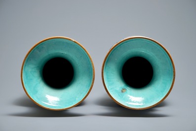 A pair of Chinese famille rose blue-ground vases, 19th C.