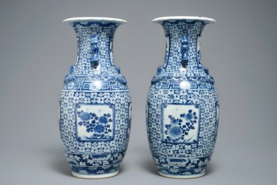 A pair of Chinese blue and white vases with figurative medallions, 19th C.