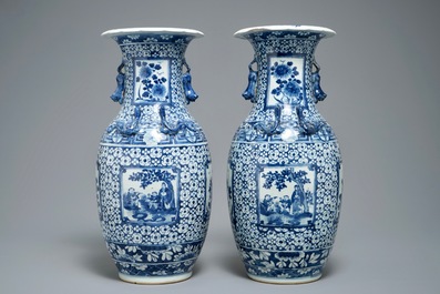 A pair of Chinese blue and white vases with figurative medallions, 19th C.