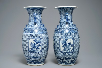 A pair of Chinese blue and white vases with figurative medallions, 19th C.