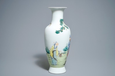 A Chinese famille rose vase with figures in a garden, Hongxian mark, 20th C.