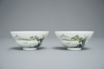 A pair of Chinese famille rose tea bowls with a landscape, Qianlong mark, 20th C.