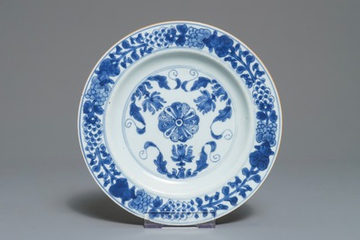 Three Chinese blue and white and Kakiemon-style plates, 18th C.