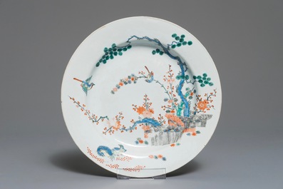 Three Chinese blue and white and Kakiemon-style plates, 18th C.