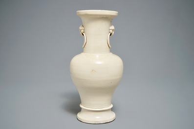 A Chinese monochrome cream-glazed vase and a tripod censer, Ming