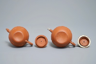 Two Chinese Yixing stoneware teapots with applied floral design, Kangxi