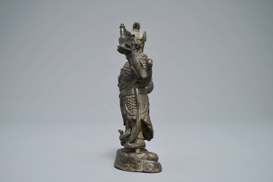 A Chinese bronze figure of the guardian king Dhanada, Ming