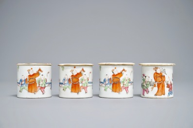 Four cylindrical Chinese famille rose covered boxes, 19th C.