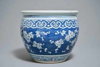 A Chinese blue and white fish bowl with design of prunus on cracked ice, 19th C.