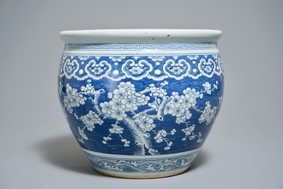 A Chinese blue and white fish bowl with design of prunus on cracked ice, 19th C.