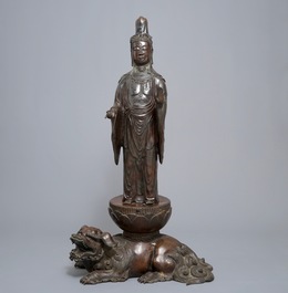 A large Japanese bronze group of Kannon on a Shi-shi, Meiji, 19th C.