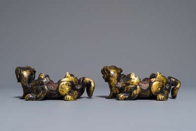 A pair of Chinese gilt bronze mythical beasts with traces of seal wax, Han or later