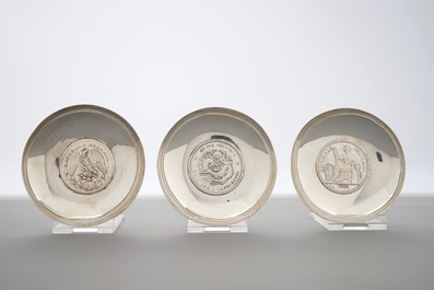 Nine Chinese silver coin bowls, mark of Wang Hing, 19/20th C.