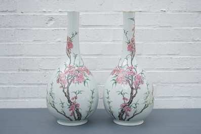 A pair of large Chinese famille rose bottle vases with floral design, 19/20th C.