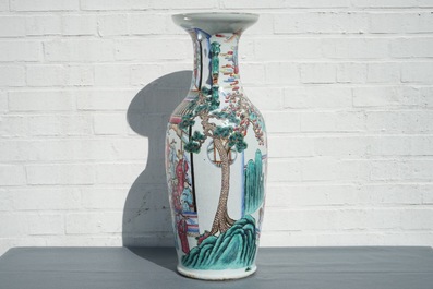 A Chinese famille rose vase with circular court scene design, 19th C.