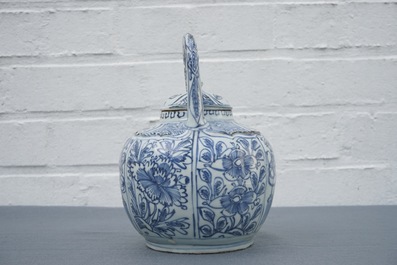 A Chinese blue and white kraak porcelain wine jug and cover with precious objects and flowers, Wanli