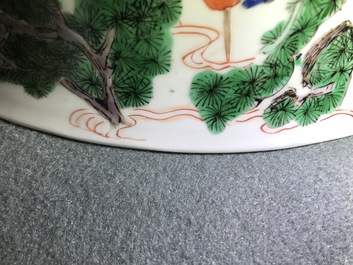 A large Chinese famille verte bowl with figures in a landscape, Kangxi