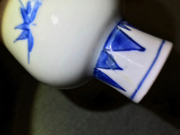 A Chinese blue and white bottle vase with floral design, Transitional period