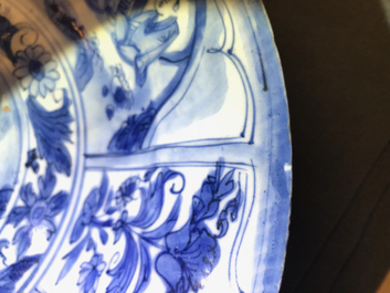 A Chinese blue and white dish with figures in a landscape, Transitional period