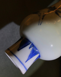 A Chinese blue and white bottle vase with floral design, Transitional period