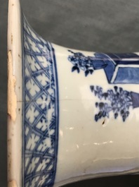 A pair of Chinese blue and white vases with ladies at a table, 19th C.