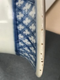 A pair of Chinese blue and white vases with ladies at a table, 19th C.