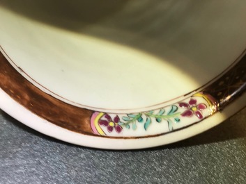 A reticulated double-walled Chinese famille rose cup and saucer, Yongzheng