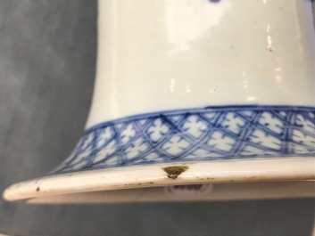 A pair of Chinese blue and white vases with ladies at a table, 19th C.