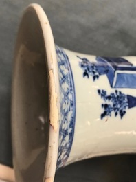 A pair of Chinese blue and white vases with ladies at a table, 19th C.