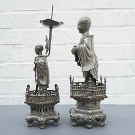 A Chinese pewter candlestick and a figure of a boy, 19/20th C.