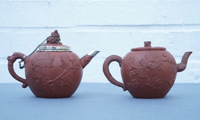 Two Chinese Yixing stoneware teapots with applied floral design, Kangxi