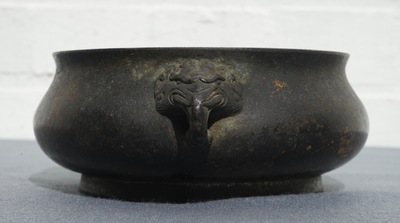 A Chinese bronze incense burner with elephant head handles, qianqing gongbao mark, Ming