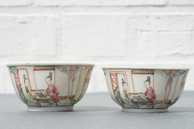 A pair of fine Chinese famille rose cups and saucers with figures in a garden, Yongzheng/Qianlong