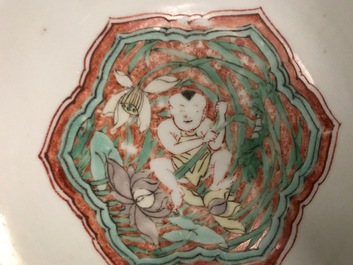 A Chinese wucai bowl with boys holding lotus flowers, Transitional period